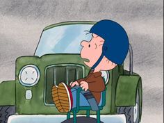 a cartoon character sitting on a chair in front of a green truck