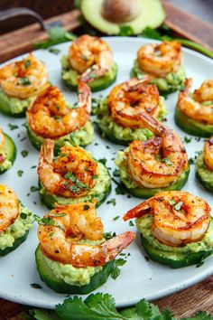 shrimp and guacamole cups with avocado garnish on a white plate