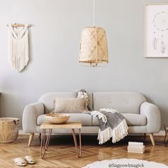 a living room filled with furniture and decor on top of hard wood floored floors