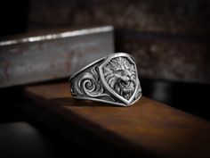 Signet lion ring for pinky finger in sterling silver, Oxidized 925 sterling silver zodiac leo ring, Good gift ida for mens, Lion man rings The lion is considered a protector and a symbol of power and success. Therefore, if you wear a ring on the right hand, you activate your leadership skills and the desire to win. When you choose the left hand, a lion ring will give more protection and self-confidence. the lion is also the symbol of Leo, one of the 12 signs of the zodiac. Leo is represented by Ring For Pinky Finger, Lion Rings For Men Gold, Leo Ring, Lion Jewellery, Man Rings, Lion Head Rings For Men, Lion Man, Lion Signet Ring, Lion Pendant Men