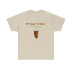 Celebrate Your Favorite Brew in Style! Quench your thirst for humor and style with our "My Favorite Beer...Is the one in front of me!" tee shirt. Perfect for beer enthusiasts and fun-lovers alike, this shirt is more than just a piece of clothing - it's a statement! Get one for your favorite beer drinker. Made with high-quality, breathable fabric, it promises comfort whether you're at a bar, a BBQ, or just lounging at home. Features: Eye-Catching Design: Bold front text with a whimsical touch, featuring a cartoon hand holding a beer mug. Quality Material: Soft, durable fabric that stands the test of washes and wears. Versatile Wear: Ideal for casual outings, beer festivals, or as a quirky gift. Sizes: Available in a range of sizes to ensure a perfect fit for all. History of the Tee Shirt: T Beer T-shirt, Beer Merch, Beer Aesthetic, Collective Identity, High Fashion Runway, Screen Printing Techniques, Beer Drinker, Dorm Ideas, T Shorts