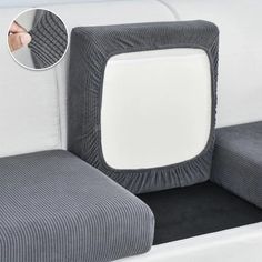 a close up of a seat cushion on a white couch with black and gray stripes