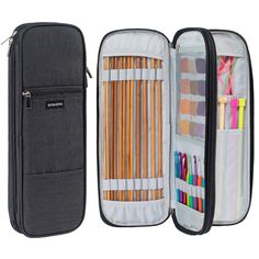 an open pencil case filled with lots of colored pencils