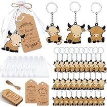 an assortment of wooden tags and key chains with cow images on them, along with labels that say thank you