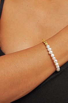 Elevate your wrist game with our Zarina Pearl Mix Bracelet – a stunning blend of pearls and gems crafted to adorn your wrist with timeless elegance. Picture yourself effortlessly commanding attention at every turn, your wrist adorned with lustrous pearls and shimmering gems, a symbol of your unique style and sophistication. Embrace the power of femininity with every flick of your wrist as this bracelet whispers tales of timeless beauty and grace. Pearl Chain Bangle Bracelets, Pearl Bangle Bracelet With Pearl Chain, Pearl Bracelet With Pearl Charm For Formal Occasions, Formal Pearl Bracelet With Pearl Charm, Pearl White Bangle Bracelet With Pearl Charm, Classic Pearl Charm Bangle Bracelet, Elegant Adjustable Bracelet With Pearl Drop, Pearl White Bangle With Pearl Charm, Elegant Pearl Bracelet With Pearl Chain