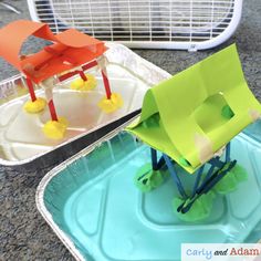 two plastic chairs sitting on top of a blue tray