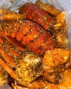 cooked lobsters with seasoning in a plastic bag