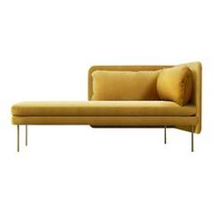 a yellow couch sitting on top of a metal frame