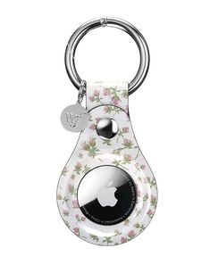 an apple keychain with flowers on the front and back, attached to a metal ring