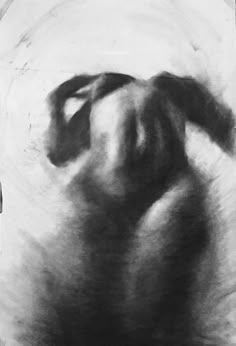 a black and white photo of a person's back with their hands behind them