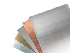 several different types of metal sheets stacked on top of each other