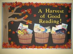 a harvest of good reading bulletin board with three buckets full of books and leaves