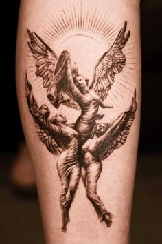 a tattoo on the leg of a person with an angel and two cherubs