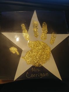 a star with gold glitter on it and the name mr corgann written on it