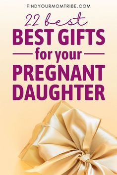 a present wrapped in gold paper with the words best gifts for your pregnant daughter on it