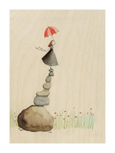 a woman holding an umbrella standing on top of a pile of rocks with grass and flowers