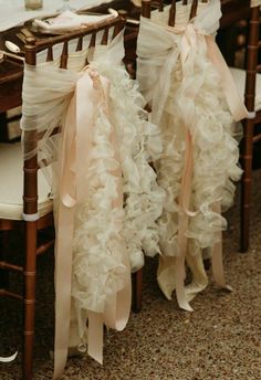 wedding chairs with ruffled sashes on them