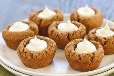 small cupcakes with icing on a white plate