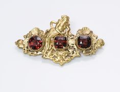 G. Accarisi Firenze Garnet Cherub Brooch.Antique 18K yellow gold cherub brooch/pin with rubies, signed G. Accarisi Firenze. Approximate Measurements: Length 2.1", Width 1.2" Weight: 11 Grams. Made in: Italy. Garnet And Gold, Genuine Love, Vintage Watches, Antique Jewelry, Brooch Pin, Vintage Antiques, Garnet, Ruby, In Italy