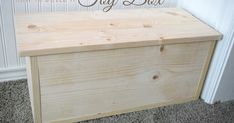 a wooden box sitting on the floor in front of a door with words that say diy best