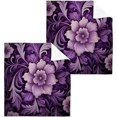 two purple and white flowers on a black background