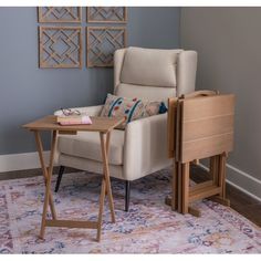 a chair and table in a room with blue walls