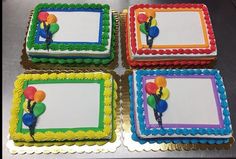 four birthday cakes with balloons on them sitting on a table