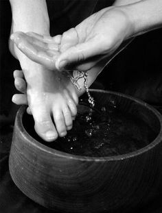 a book cover for maundy thursday with two hands reaching into a pot