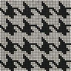 a black and white cross stitch pattern on fabric