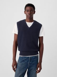 Soft, textured cotton sweater vest.  V-neck.  Sleeveless.  Banded hem.  * Fit: Classic.  A straight & easy fit.  Hits at the hip.  Models are 6′1″–6′2″ 185 cm–188 cm) with a 31″ 79 cm) waist & 32–33″ 81 cm–84 cm) inseam & are wearing Gap Classic Cotton V-neck Tank Top, Classic V-neck Vest For Layering, Classic Cotton V-neck Sweater Vest, Casual Cotton V-neck Vest, Cotton V-neck Sweater, Classic Cotton Sweater Vest For Work, Fitted Cotton V-neck Sweater, Fitted Cotton Sweater Vest For Layering, Classic V-neck Vest For Fall