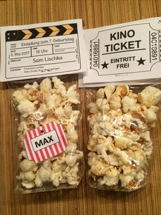 two bags of popcorn sitting on top of a table