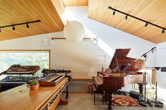 a room filled with lots of musical equipment