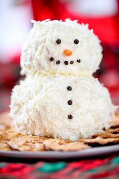 a snowman made out of rice krispy kreme on a plate