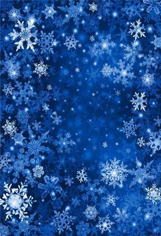 snowflakes are falling down on a blue background