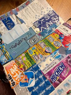 an assortment of japanese stickers on top of a piece of paper that is cut into squares