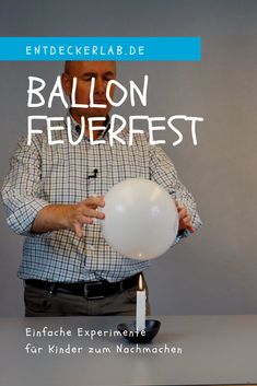 a man holding a balloon in front of a candle