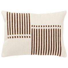 a brown and white striped pillow on a white background