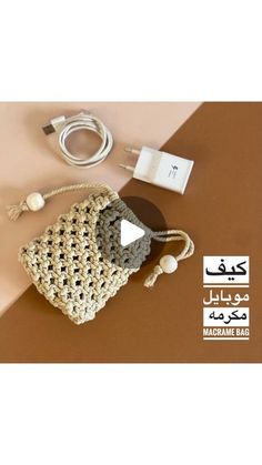 the contents of a crocheted bag are displayed on a table with wires and cords