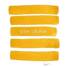 four yellow strokes with the words stay golden written on one side and two different ones in white