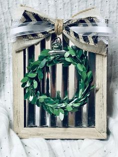 a wooden frame with a wreath hanging on it