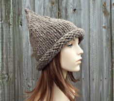 Knit Hat Style: Witch Hat - a chunky pointed witch or elf beanie with a rolled brim for women, men and teens. Color: This sample hat is shown in Barley, a light brown with tweed neps. You can choose from 33 colors. Please see the last two photos in the listing and zoom in for a visual reference of your color choices, then select it from the drop down menu when ordering. Sizes: One size fits average teen or adult head size of 20" to 23" (50.5 cm to 58 cm). Circumference at brim band 19" (48 cm) u Witch Hat Halloween, Halloween Hat, Hood Hat, Gnome Hat, Chunky Knit Hat, Pixie Hat, Handmade Knitwear, Womens Hat, Halloween Hats