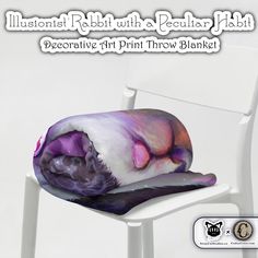 a white chair with a purple pillow on top of it and the words decorative art print throw blanket