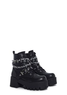 These boots have a vegan leather construction, treaded soles, buckle details, a removable silver chain link, front lace-ups, and side zipper closures. Edgy Combat Boots With Buckle Closure For Streetwear, Edgy Combat Boots With Buckle For Streetwear, Edgy Combat Boots For Streetwear With Buckle Closure, Edgy Streetwear Combat Boots With Buckle Closure, Edgy Lace-up Combat Boots With Buckle Closure, Punk Style Lace-up Boots With Buckle Closure, Lace-up Boots With Buckle Closure For Streetwear, Chain Detail Boots With Round Toe For Streetwear, Chain Detailed Round Toe Boots For Streetwear