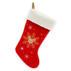 a red christmas stocking with snowflakes on it