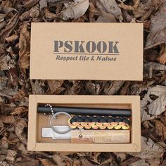 the box is open and has a keychain in it that says pskok respect life & nature