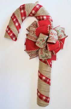 a red and white christmas decoration with burlocks on it's headband