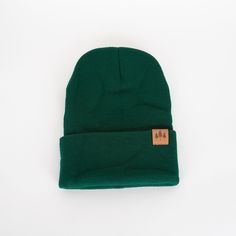 "Add a touch of nature with our Three Tree Foldover Beanie - Emerald. Featuring a suede small patch and a stylish fold over design, this beanie will keep you cozy and on trend. Perfect for chilly days and adventurous souls." One size fits all. A Montana Scene Original Design. All designs are property of The Montana Scene. All rights reserved.All of The Montana Scene apparel is designed and printed locally in Montana. Come visit our storefront locations! Bigfork * Whitefish * Missoula * Kalispell Getting Cozy, Soft Suede, Fold Over, Keep Warm, All Design, One Size Fits All, Original Design, Montana, Original Designs