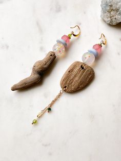 "ABOUT THIS PIECE:  Handcrafted, one-of-a-kind eco-friendly earrings that entail recycled beach glass, Swarovski Crystal, silicone, ceramic and driftwood assembled to gold stainless steel earring wire.  Approximately 4-5\" long.  These statement earrings are great for a special occasion (like a beach wedding) to a casual day with a t-shirt and jeans.  Very lightweight.  Sweet gift for yourself or someone special.  The Driftwood was sourced at the beach near our home in Toronto. ADDITIONAL FUN DETAILS: Driftwood represents life and its ever-changing way, unity and oneness. Driftwood is a sustainer of our environment with its many versatile uses; from reducing deforestation to being crafted into toys, sheds and usable art, like the jewellery at Ruby Blue Co.  Driftwood is believed to promote Driftwood Earrings, Driftwood Jewelry, Earring Wire, Earrings Unique, Earrings Minimalist, Dangly Earrings, Sweet Gifts, T Shirt And Jeans, Beach Glass