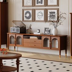 a living room filled with furniture and pictures on the wall above it's coffee table