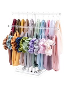 a rack with many different colored ties hanging on it